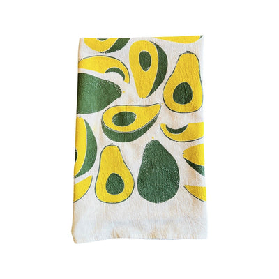 folded Avocados Tea Towel features graphic of sliced avocados