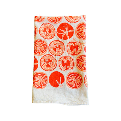 folded Avocados Tea Towel features graphic of sliced tomatoes