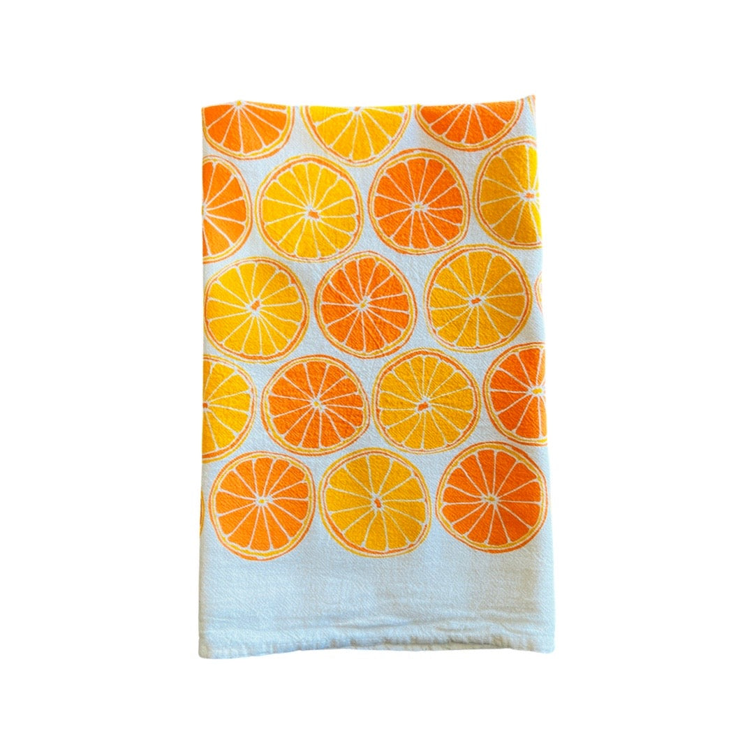 folded Oranges Tea Towel features graphic of sliced oranges