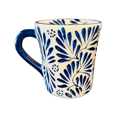 Cream colored mug with a blue plumedo pattern