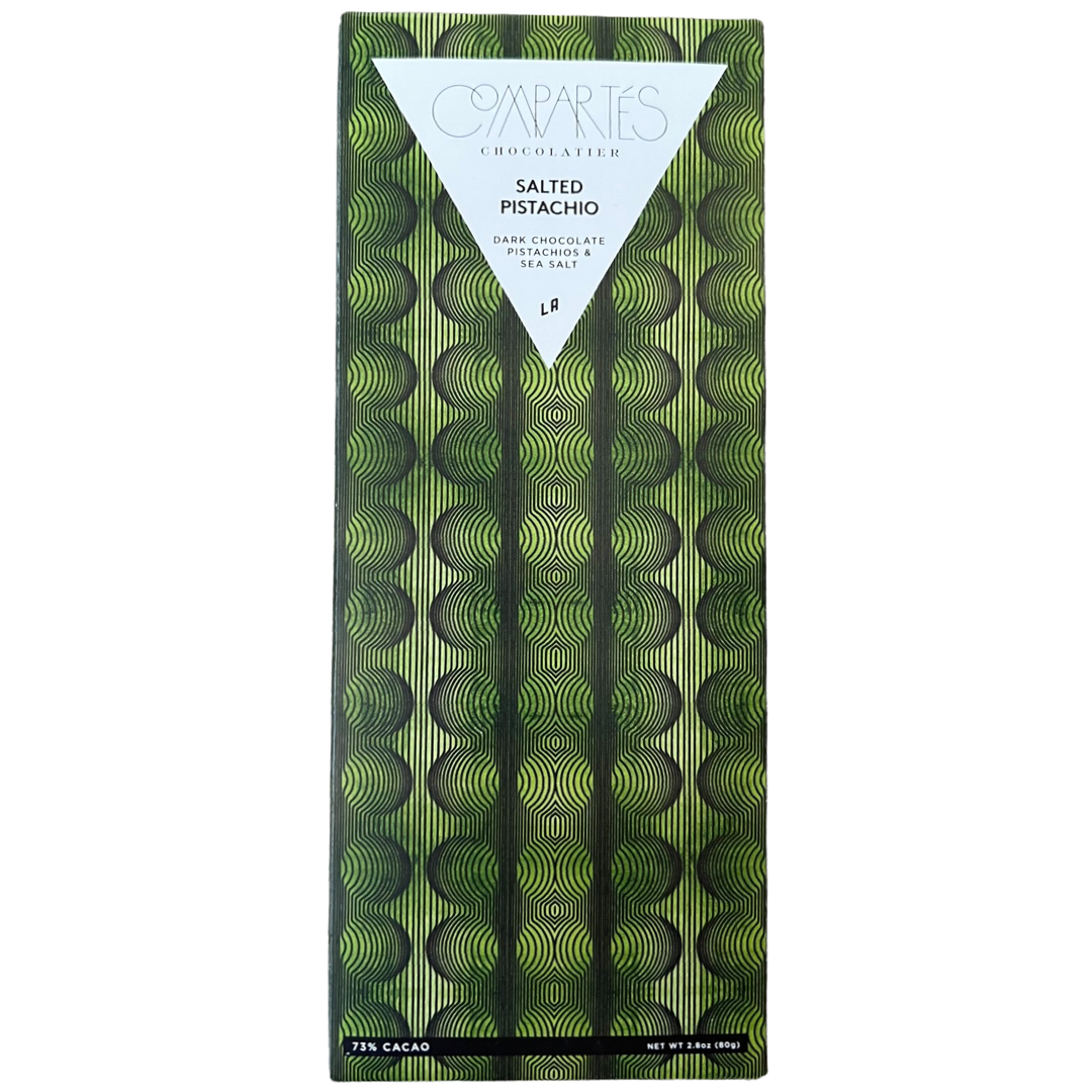 front view of Salted Pistachio Dark Chocolate Bar in paper packaging