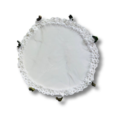 round white lace and mesh jug cover featuring green glazed mug embellishments.