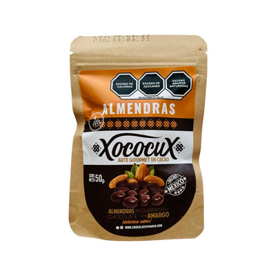 A kraft bag containing 50g of chocolate covered almonds. The label is orange, white and brown featuring a picture of almonds and chocolate covered almonds. 
