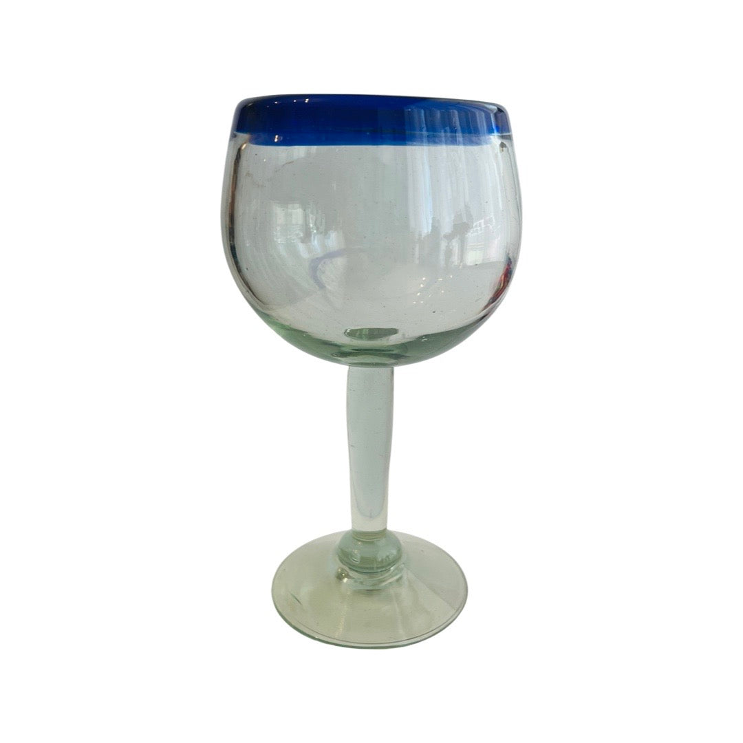 Clear glass wine drinking glass with translucent blue rim