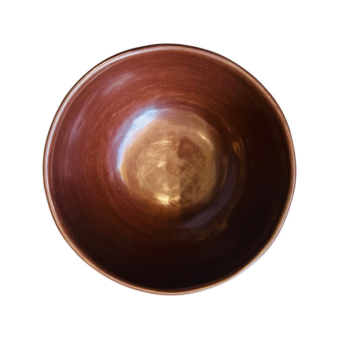 Birdseye view of burnished red clay mini bowl.