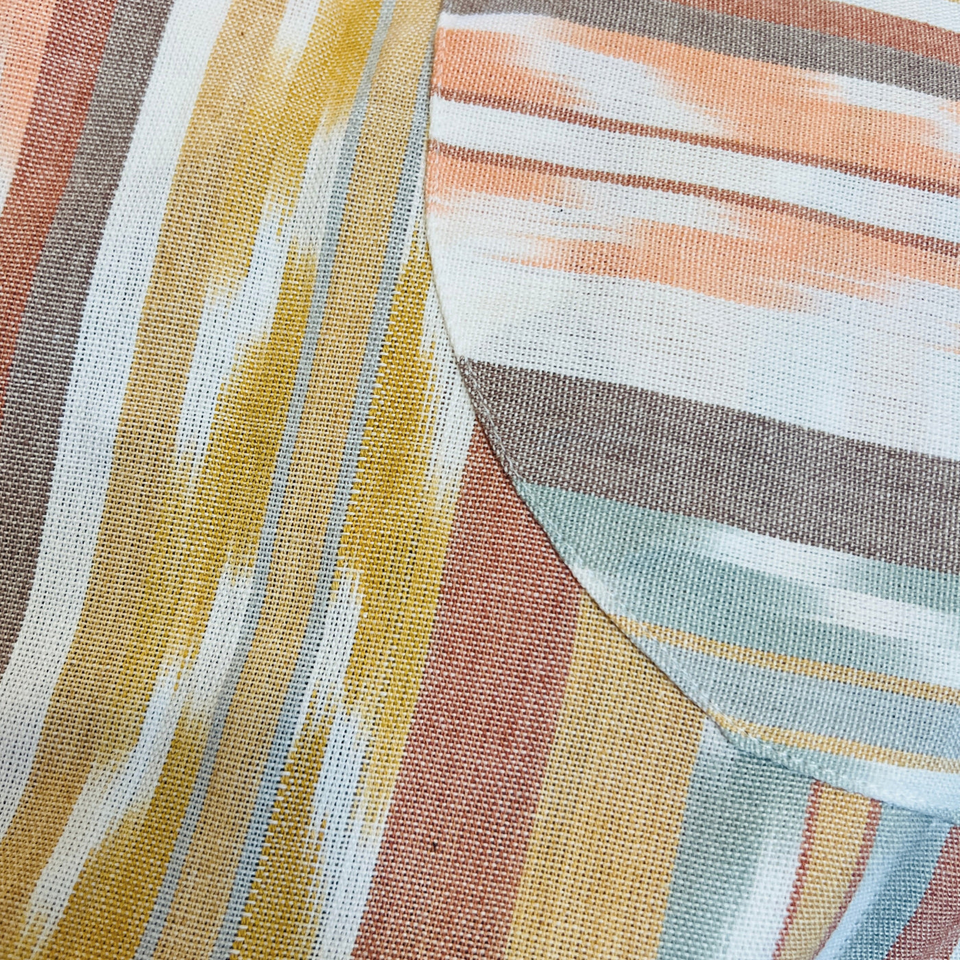 Close up of sand color tone striped design of apron