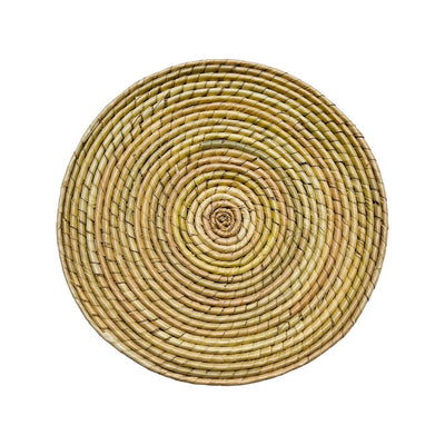 Natural colored circular woven palm placemat