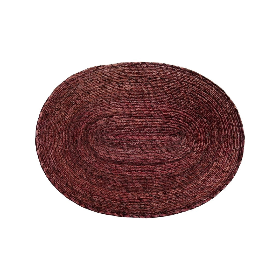 oval shaped dark brown placemat made from palm