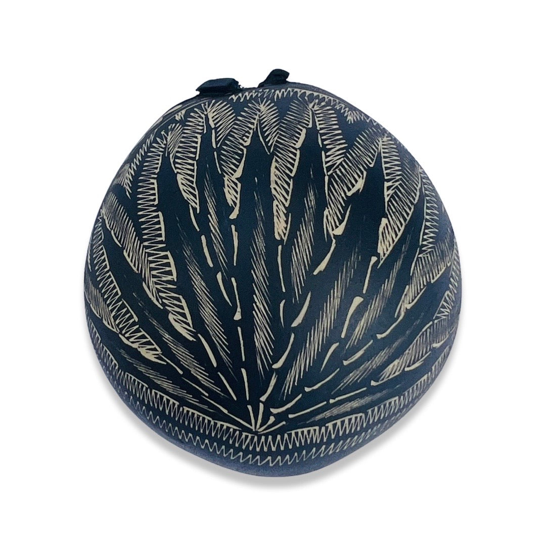 handcarved agave design on bottom of jicara