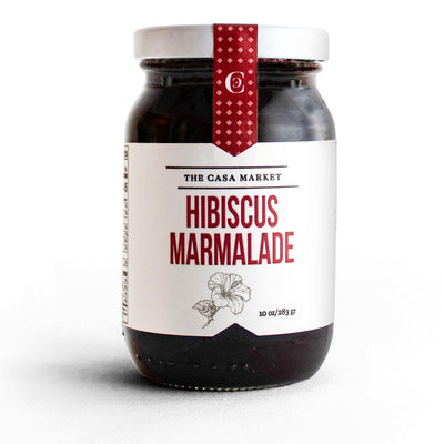 Front view of Hibiscus Marmalade in clear glass branded jar with white lid