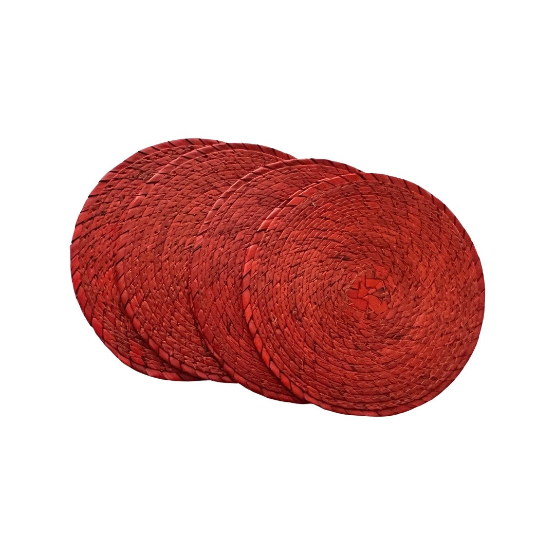 4 red circular coasters made of palm