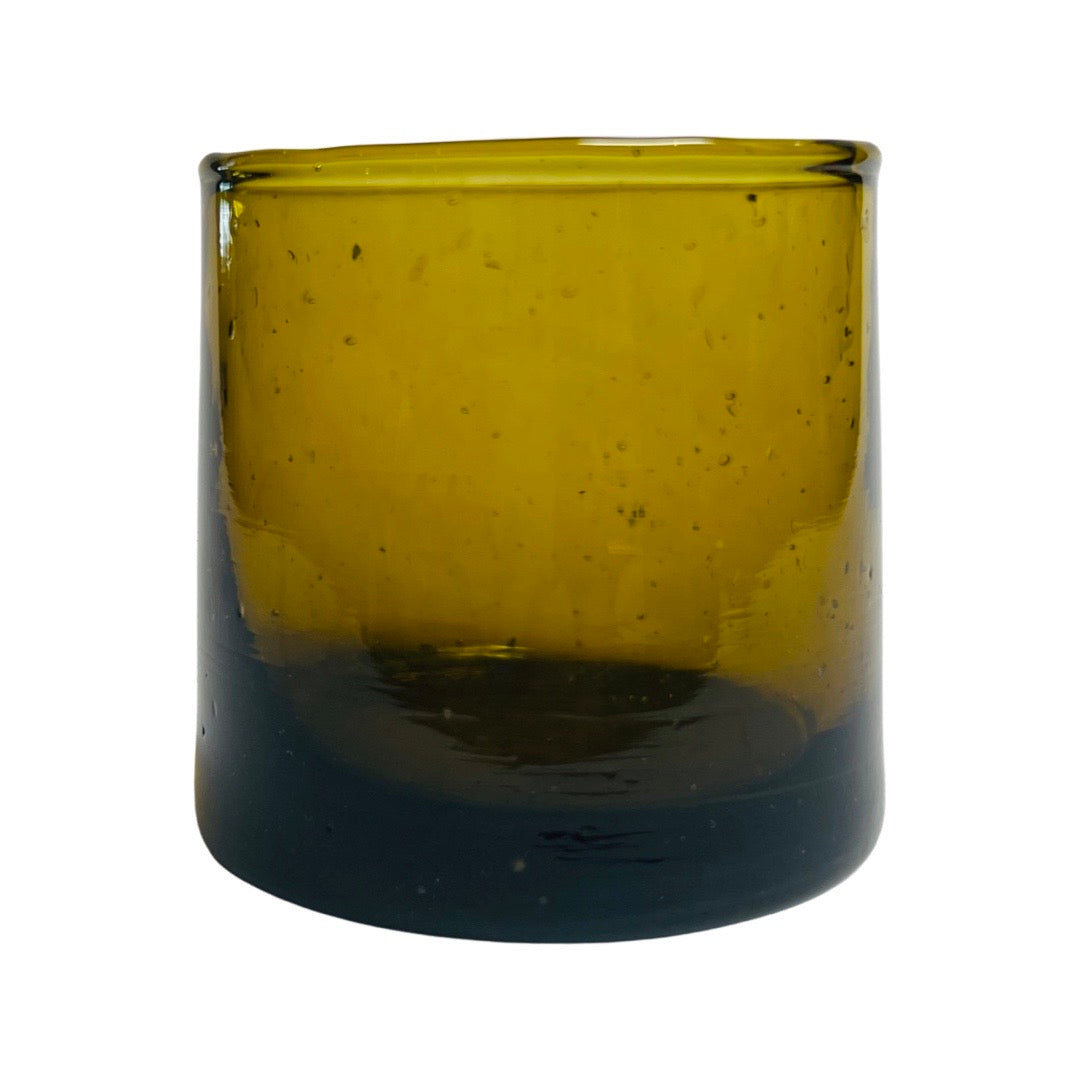 front view of translucent amber colored drinking glass