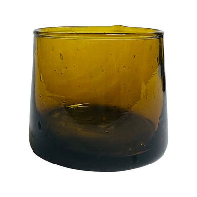 front view of translucent amber colored drinking glass