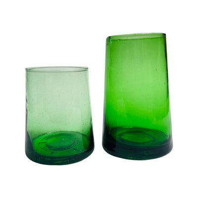 2 translucent green colored drinking glasses in varying heights