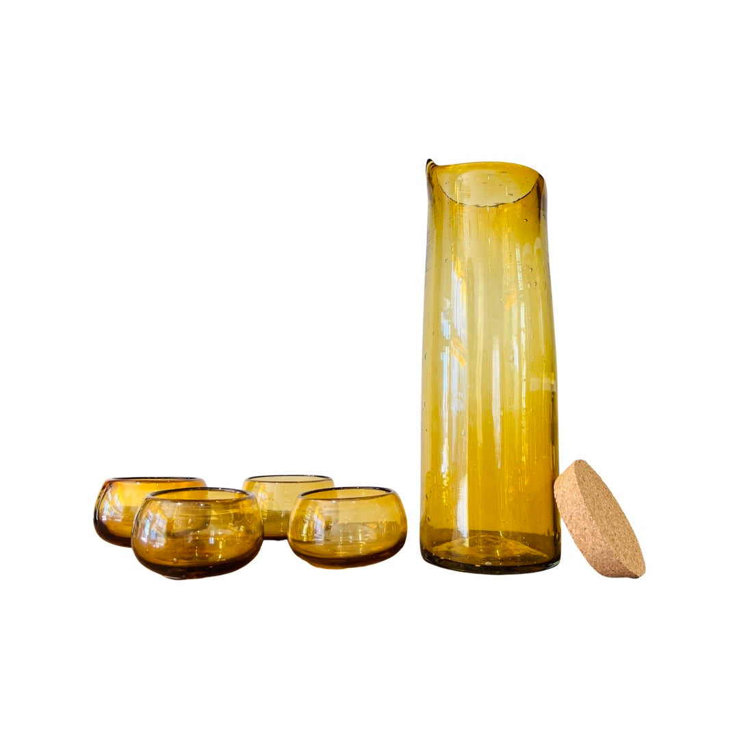 set of 4 translucent amber shot glasses and tall translucent amber pitcher with cork lid