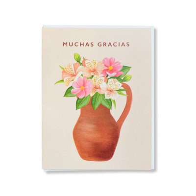 Greeting card reads Muchas Gracias, English translation is Thank You. Illustration features flowers in a clay jarrito, English translation is vase.