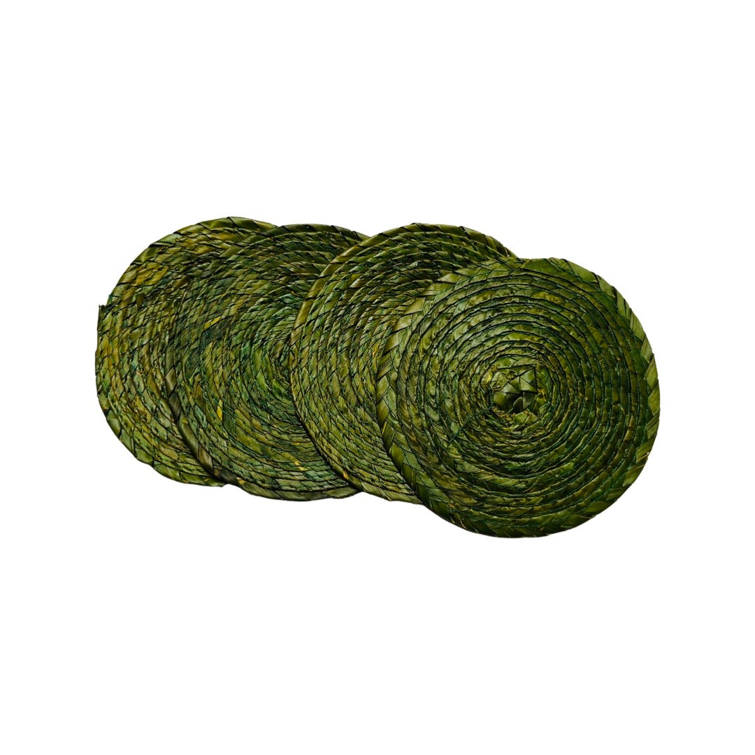4 green circular coasters made of palm