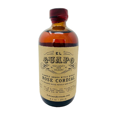 Front view of Rose Cordial Syrup in brown glass branded bottle, lid is sealed with red wax
