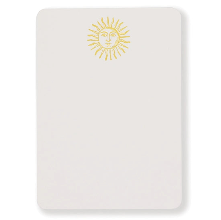Notecard features sun with a face illustration at top center