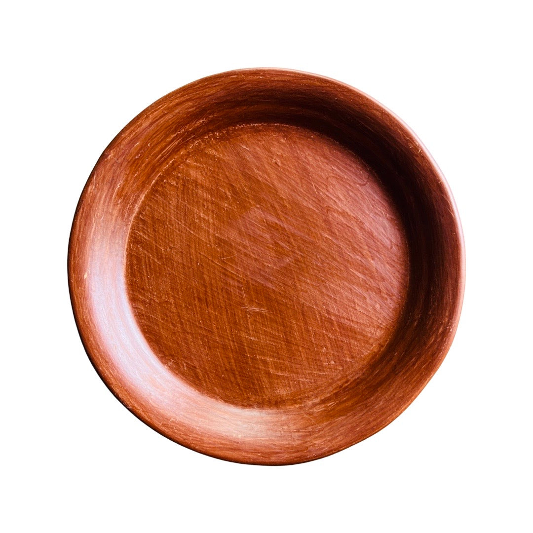 Top view of a round barro rojo (red clay) plate.