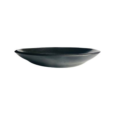 side view of a barro negro, black clay, salad bowl.