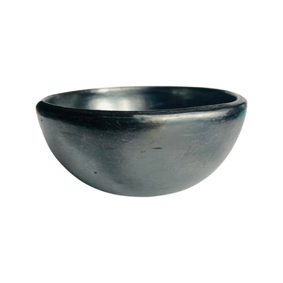 Side view of a barro negro, black clay, bowl
