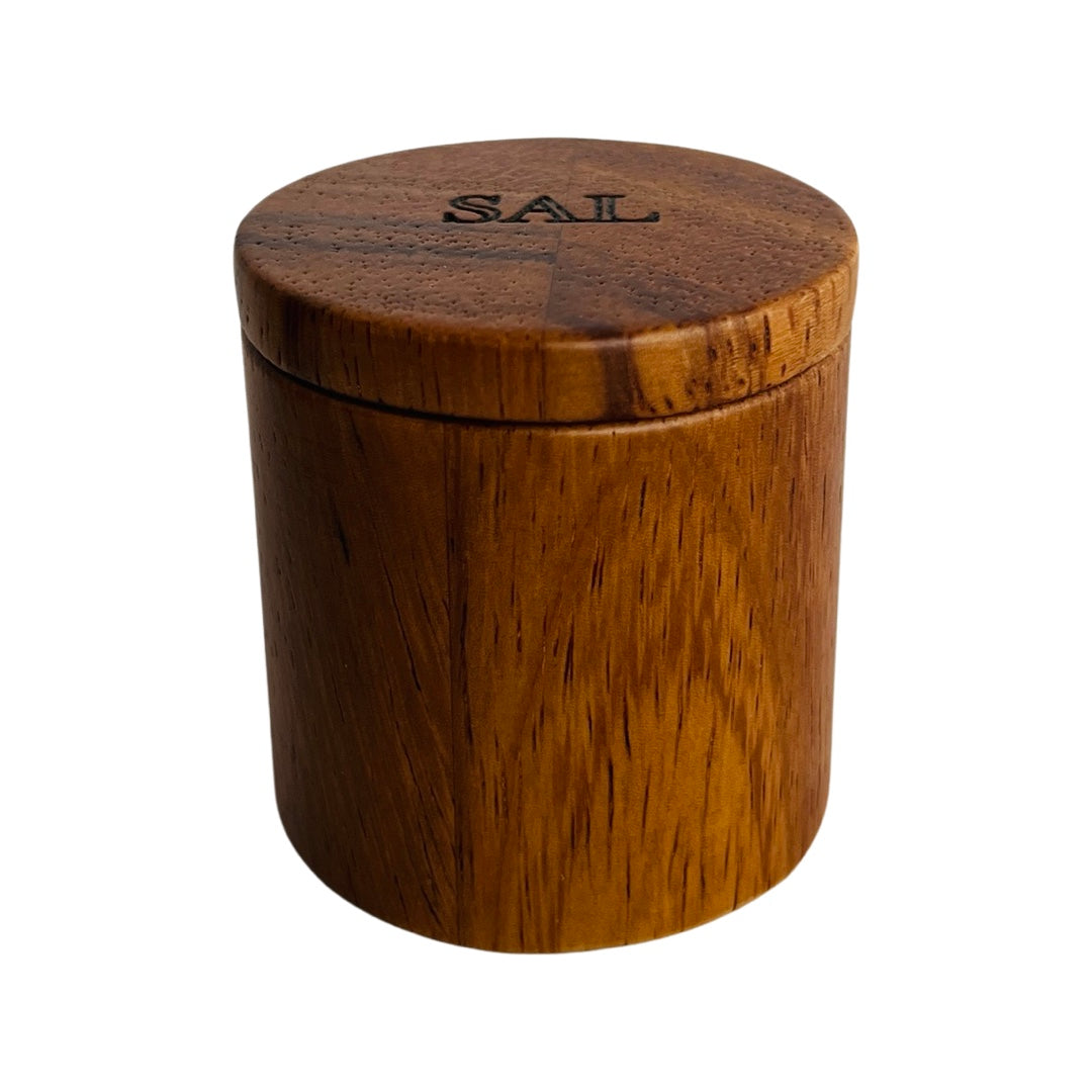 Dark wooden salt box  with the Spanish word for salt, sal, engraved on the lid.