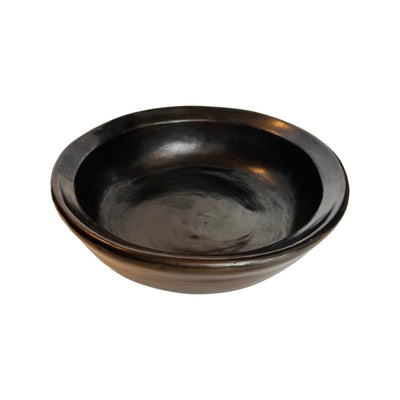 Top view of a dark brown clay bowl