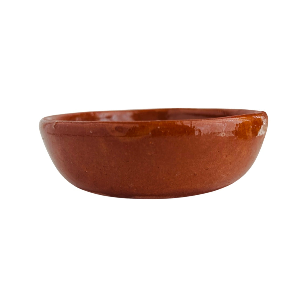 front view of glossy red clay salsa bowl.