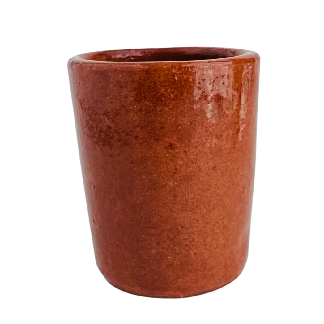 front view of red clay shot glass with glossy finish