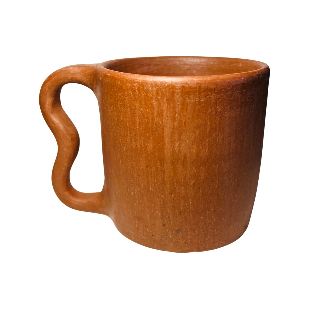 Side view of a single barro rojo, red clay, mug