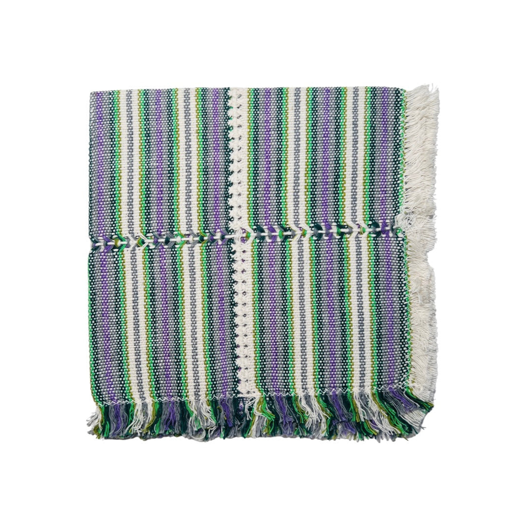 Various shades of purple and green striped handwoven napkin quarter folded