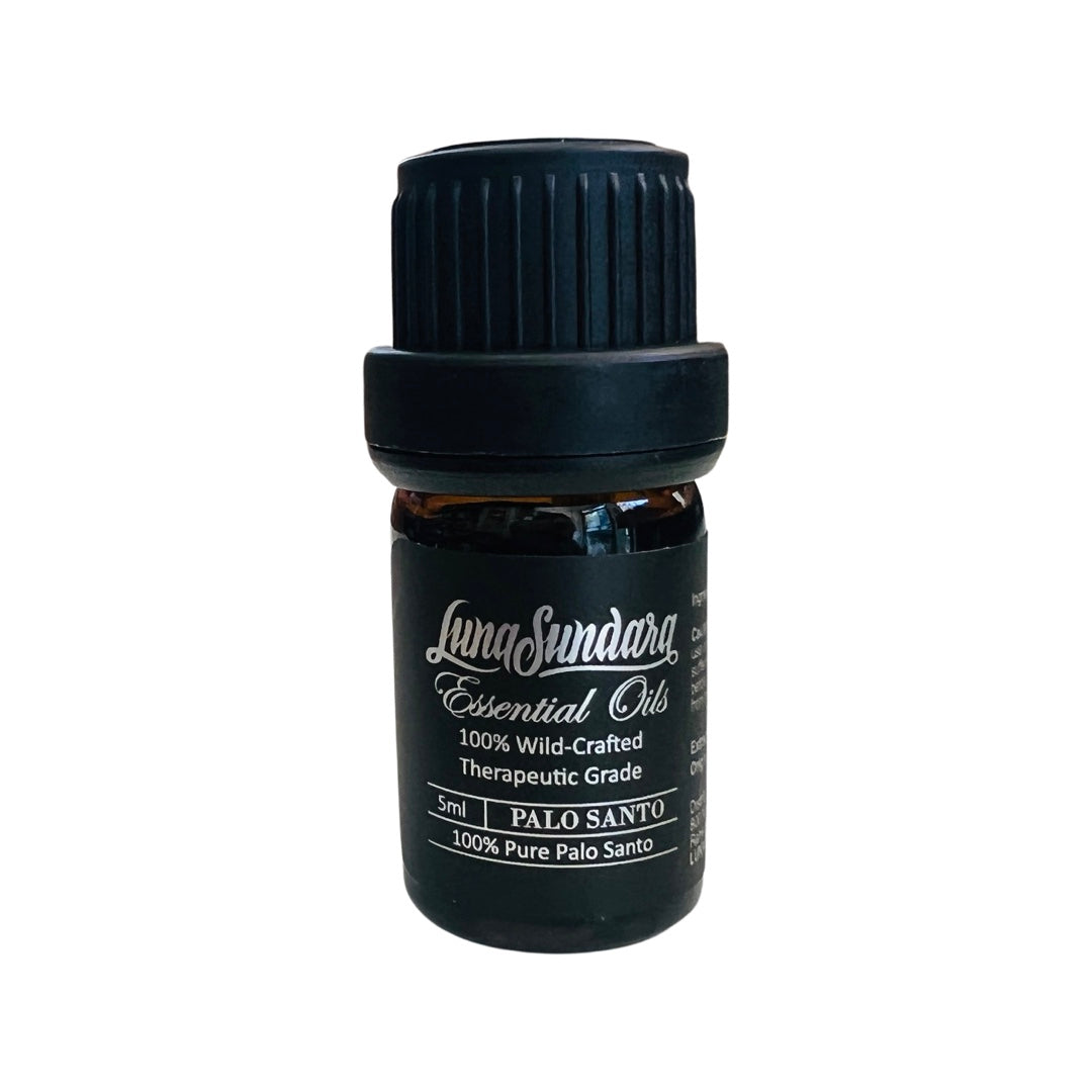 5ml bottle of essential oil with a black label featuring silver lettering. 