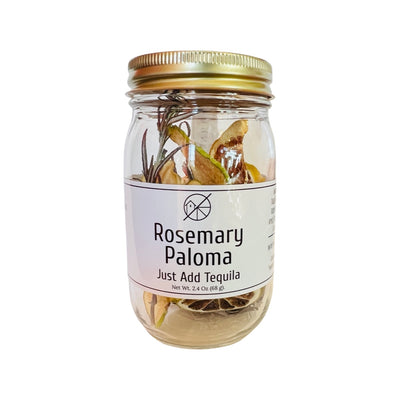 Clear 2.4 oz jar of dehydrated fruits, herbs and spices with a white branded label and gold cap.