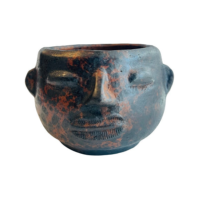 Front view of a barro face mug