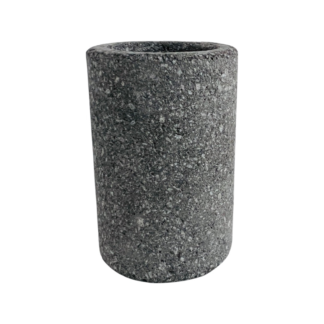 front angle of shot glass carved from dark grey stone