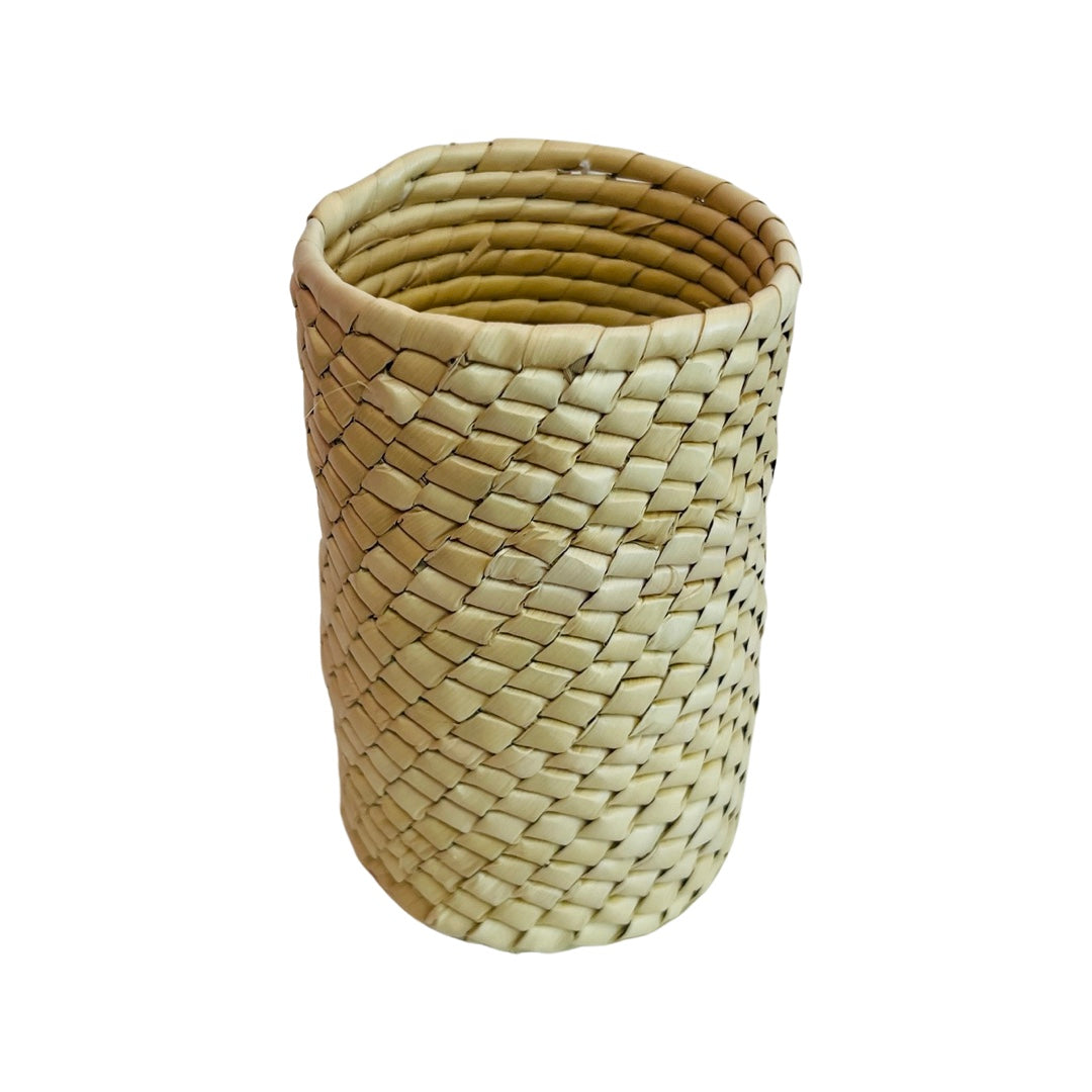 Top view of a woven palm leaf round basket