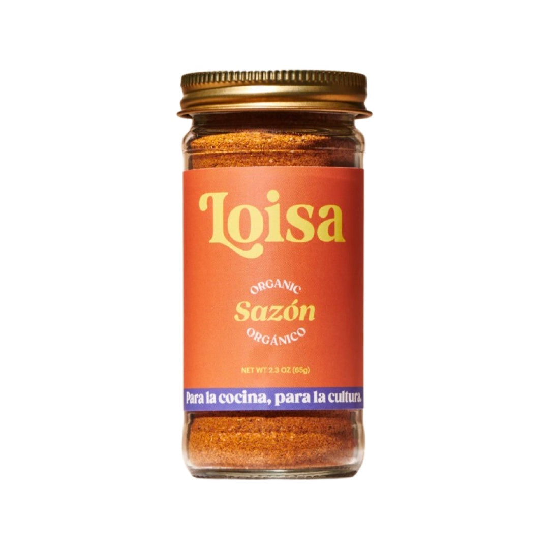 2.3 oz clear jar of sazon seasoning with an orange brand label