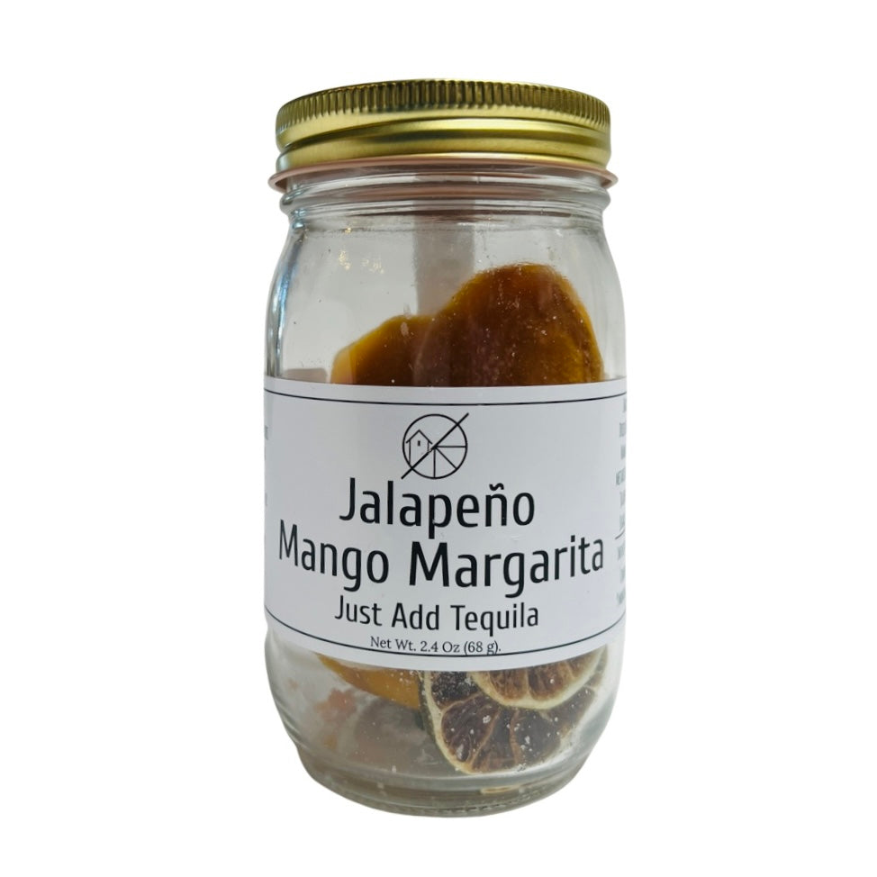 Front view of Jalapeño Mango Margarita Cocktail Infusion Kit in clear glass branded jar with gold lid