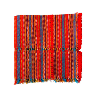 Woven cotton napkin with bright and light orange, blue and mustard stripes.