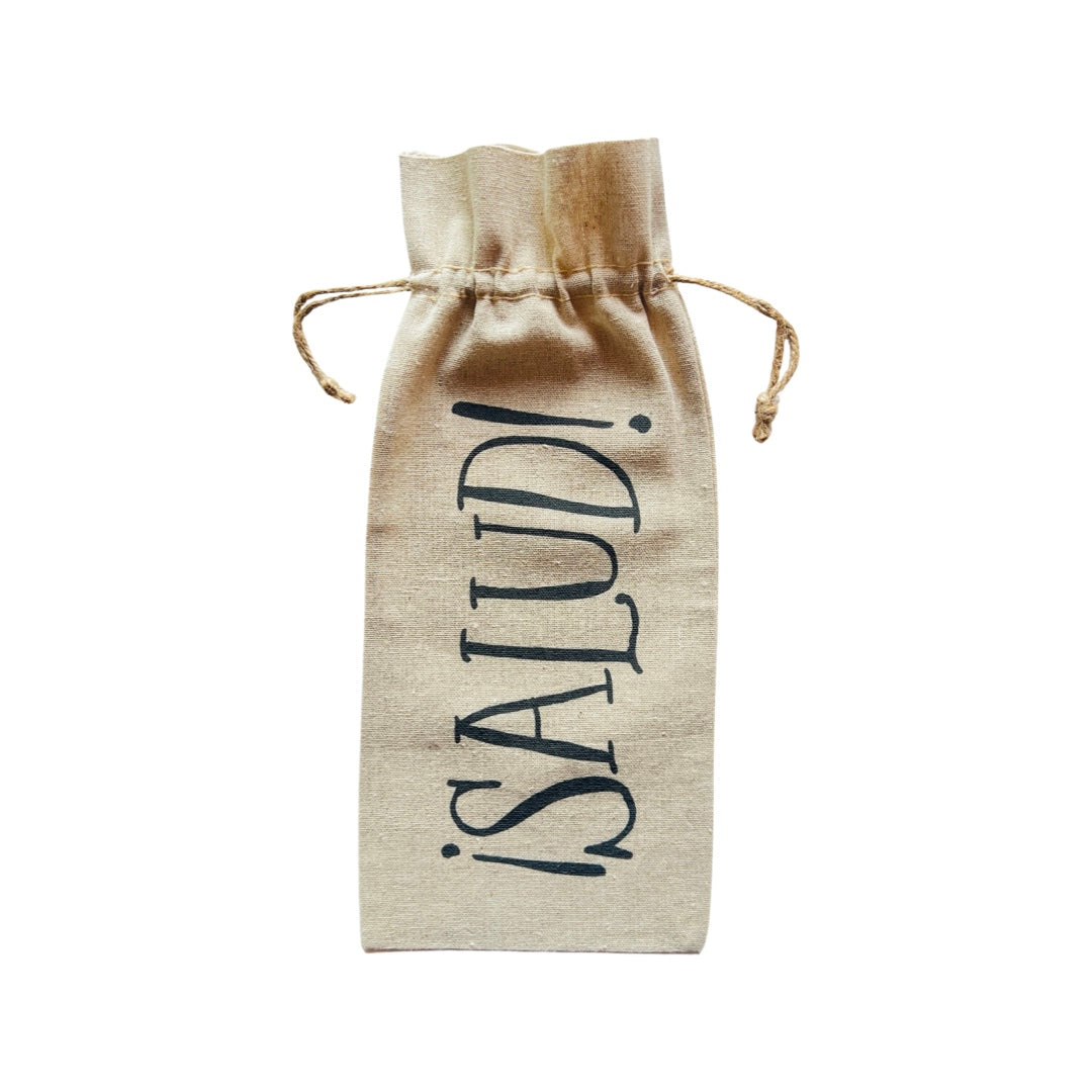 Linen wine bag with a tie string featuring the phrase Salud in black lettering. Translation: Cheers!