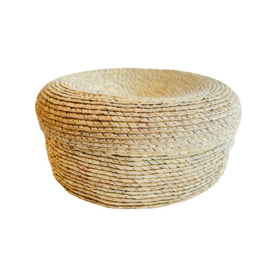 Side view of a natural palm tortilla basket.