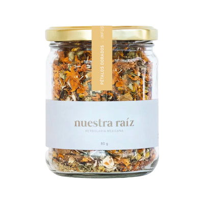 80 gram clear jar of loose leaf tea and dried flowers. Tea leaves and flowers are various shades of yellow and orange.