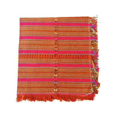 quarter folded handwoven cotton napkin with pink and various shades of orange stripes.