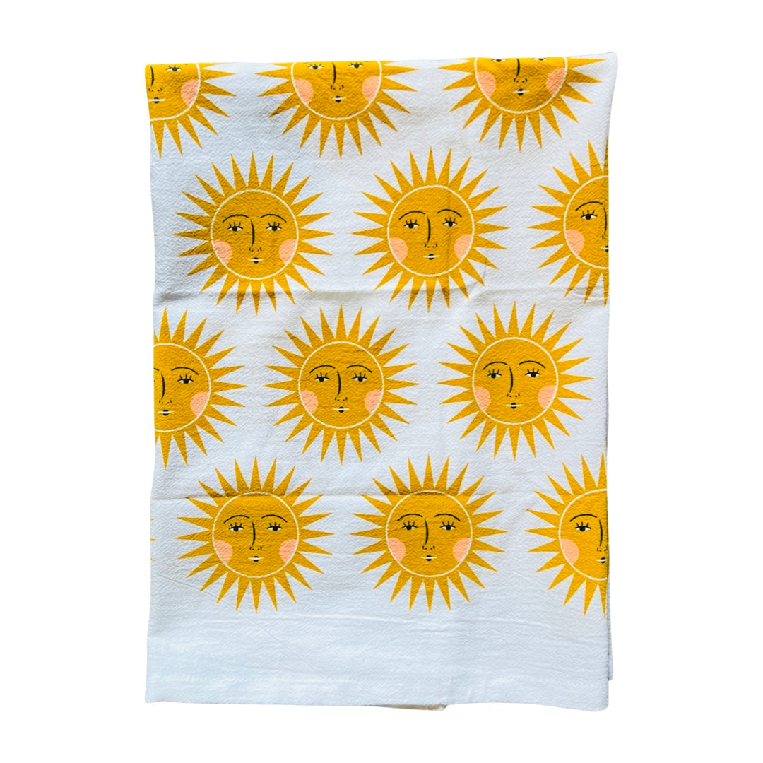 half folded white towel with a full yellow sun pattern