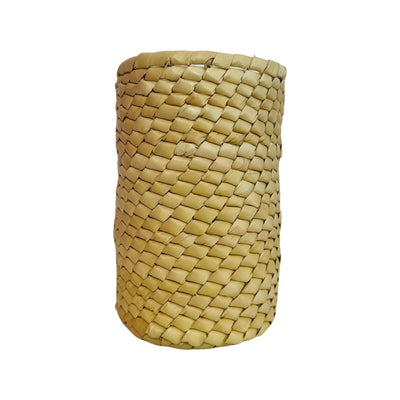 Front view of a woven palm leaf round basket