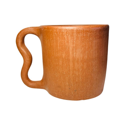 Side view of a single barro rojo, red clay, mug