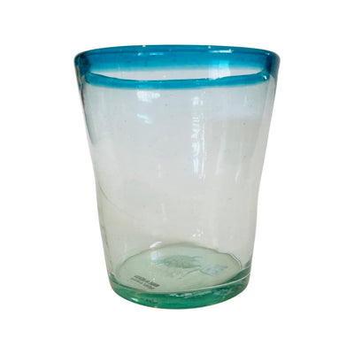 Single clear glass with a turqouise colored rim