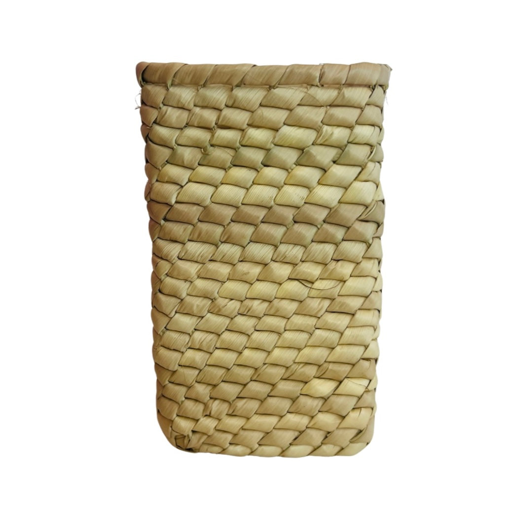 Front view of a woven palm leaf rectangular basket