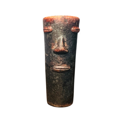 Red and black clay shot glass with a face